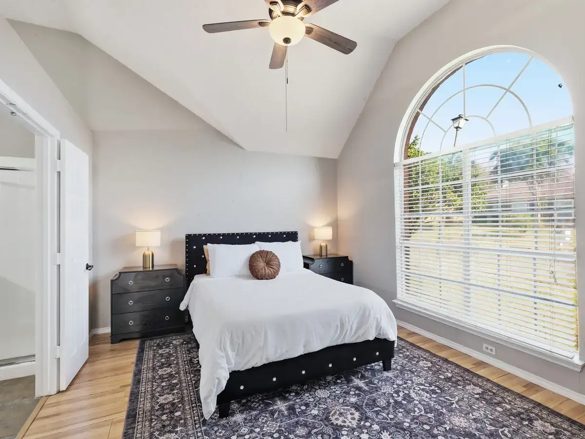 A furnished bedroom, quiet minimal styling